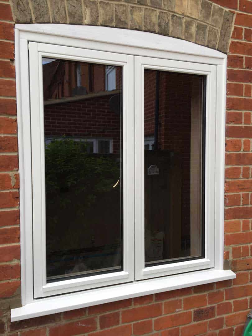 Casement window with curved header bricks