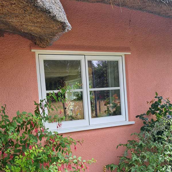 Historic window in thatched cottage
