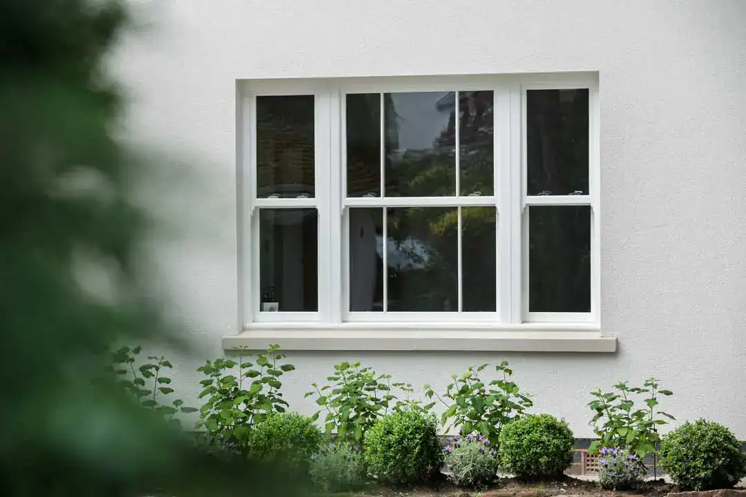 uPVC Sliding Sash Window in rendered property